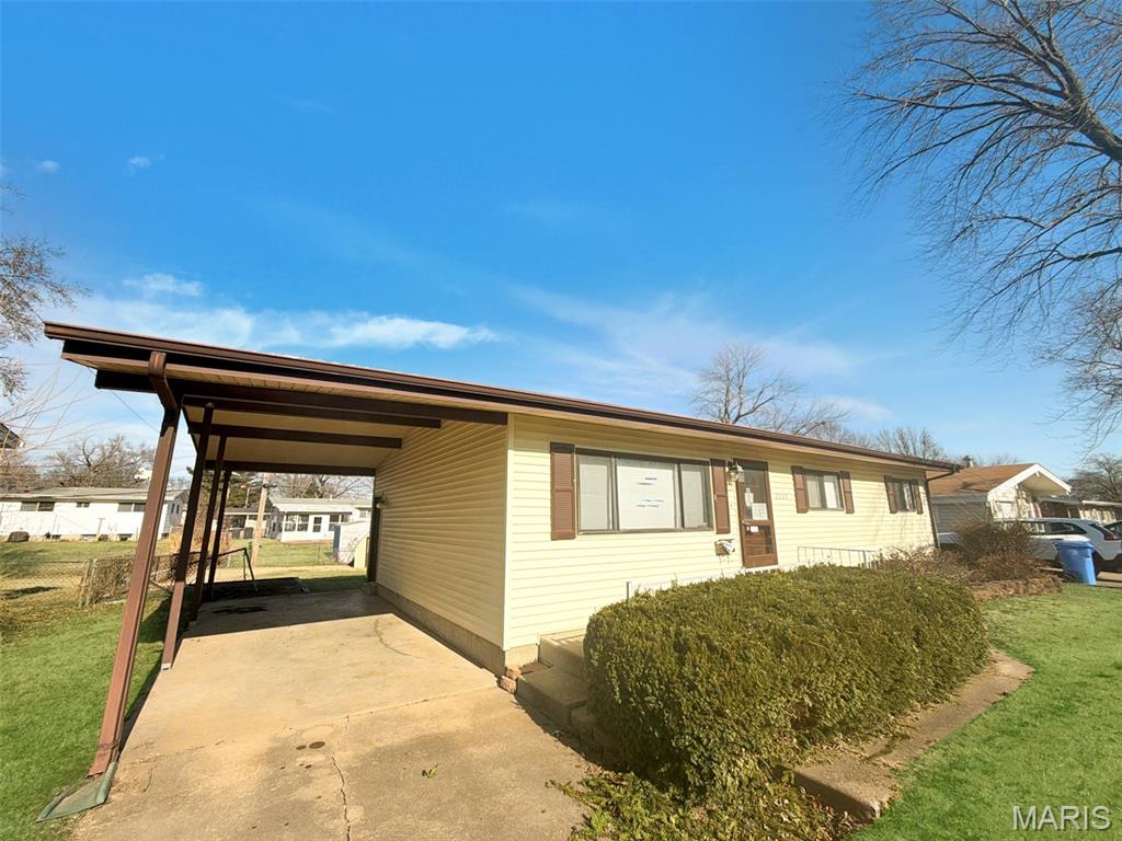 Charming and full of potential! This 3-bedroom, 1-bathroom ranch home in Florissant offers a functional layout and fantastic outdoor space. The main level features well-appointed living spaces, while the partially finished basement provides excellent bonus square footage for a home office, recreation room, or additional storage.

Outside you'll find a spacious, flat backyard—fully fenced and perfect for outdoor activities. The property also includes a convenient storage shed for tools and gear, plus a 1-car carport to keep your vehicle shielded from the elements. Don't miss your chance to see this versatile home!