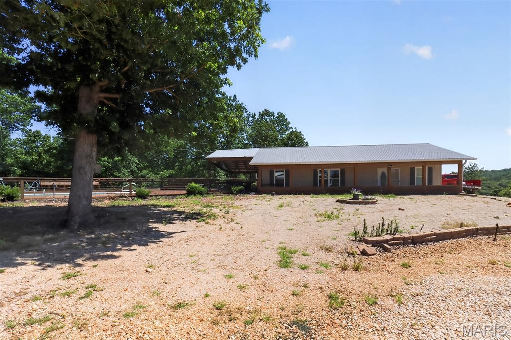 A truly one-of-a-kind opportunity on 119 acres in the heart of the Missouri Ozarks! This exceptional property offers endless possibilities with multiple residences, a commercial building, and expansive acreage all on one parcel. Whether you're looking for a private family retreat, investment property, event venue, hunting getaway, or business opportunity, this property is ready to bring your vision to life. The main residence is complemented by additional living quarters, while the commercial building provides space for a variety of potential uses. Enjoy open fields, wooded acreage, scenic views, and the privacy that only a property of this size can offer. A swimming pool, multiple outbuildings, garages, and ample room for recreation further enhance this unique offering. Rarely does a property with this combination of acreage, improvements, and income potential become available.
