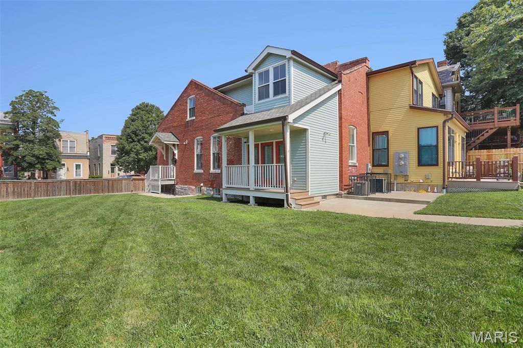 Picture your weekends starting with coffee on the porch, an afternoon spent tending your garden, and an evening walking to dinner or live music—all without moving your car. This beautifully renovated 1885 bungalow puts you in the heart of one of St. Louis' most walkable neighborhoods. Grab dinner with friends at Yemanja Brasil, Frazer's, or Peacemaker, catch a show at Venice Café, or wander over to Benton Park for movie nights, festivals, and sunny afternoons. The showstopper? The incredible double lot. It's the kind of outdoor space that's almost impossible to find in the city. Create your dream garden with raised beds, add a fire pit, let your dog run free, plant a pollinator paradise, or finally build the backyard you've been saving on Pinterest. There's even room for a pool if that's on your wish list. You get all the historic charm of an 1885 home on the exterior but on the inside, it's been thoughtfully renovated with updated systems—including zoned HVAC—so you can move right in and start enjoying your new space from day one. The main floor offers a bright living room, dining room, updated kitchen, and convenient half bath. A covered side porch overlooks the expansive fenced yard, creating the perfect spot for morning coffee or winding down after work. With no house directly to the south, natural light pours inside all day, making this a dream home for both you & your houseplants. Upstairs, you'll find two comfortable bedrooms—including one with double closets—and a full bath featuring double vanities plus skylights that flood the space with even more natural light. The squeaky clean basement adds laundry & lots of storage + the rear parking pad adds everyday convenience. If you've been searching for a home with character, outdoor space, and a neighborhood that feels like a community, this is one you won't want to miss. Skip the Zillow shuffle and reach out to me--the listing agent--to schedule your private tour.
