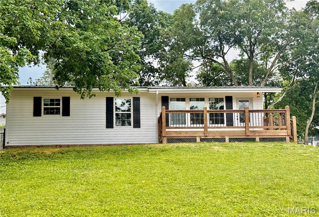 Move right into this remodeled 3-bedroom, 1 bath ranch style home with a full basement. Located in a convenient location. This charming home offers a warm and inviting feel with updated finishes throughout. Large windows let in a lot of natural light. Enjoy relaxing on the large front deck or entertaining in the large, fenced backyard with plenty of room for the kids, pets, or gatherings. Affordable, adorable, and completely move-in ready.