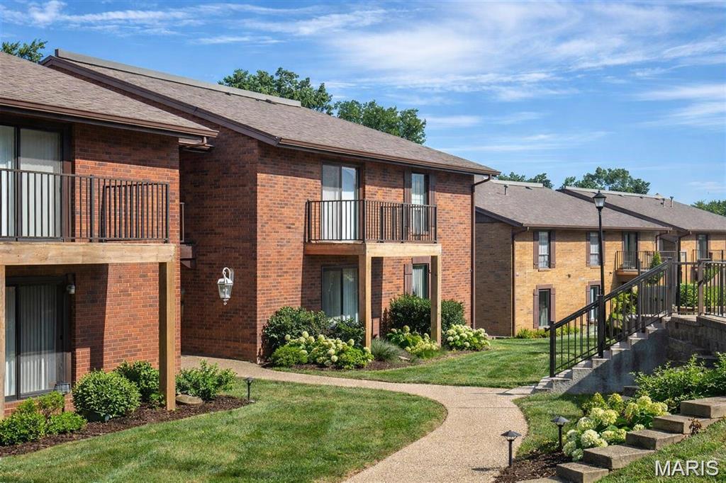 Fantastic Oakville value with serene wooded views! Tucked away in a quiet, highly desirable neighborhood, this spacious 3-bedroom, 2-full-bath condo offers the perfect blend of privacy and low-maintenance living. The main level welcomes you with a bright living area, a quaint dining space, and a kitchen that flows seamlessly out to a private, low-maintenance composite deck—perfect for morning coffee overlooking a peaceful wooded backdrop. The main floor features a private, energy-efficient owner's suite that stays perfectly cool in the summer months and offers quiet peace of mind. Upstairs, you'll find two additional generous bedrooms and a second full bath. Enjoy incredibly low HOA fees covering assigned parking, pristine grounds care, and resort-style amenities including a massive pool, clubhouse, tennis courts, and a private lake. Don't miss this structurally solid Oakville gem!