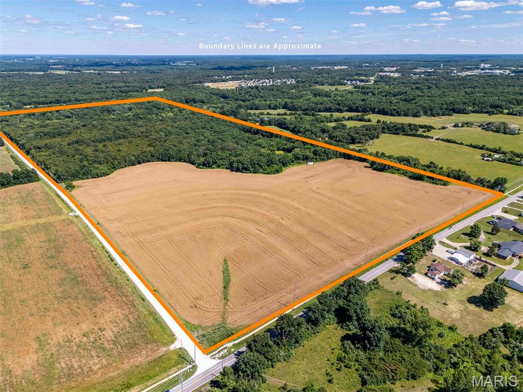 This 103-acre tract sits in the direct path of growth on the north commercial corridor of Warrenton and is only 1.5 miles north of I-70. The property features approximately 30 acres currently in crop production. Currently, the 103 acres are zoned C-3 Commercial, R-2 Residential, and AG-1 Agricultural. Visibility and access are outstanding, with roughly 1/4 mile of frontage along Highway 47 and more than 1/2 mile of frontage on Willow Road, providing multiple access points and flexibility for future planning.

Public sewer, public water, natural gas, fiber internet, and electric are all available on the property, providing a great opportunity for large-scale development. New sidewalks have been installed along North 47, reflecting the continued investment and expansion occurring in this area. The new Warrenton Elementary School is currently under construction and less than half a mile away, bringing additional traffic, rooftops, and long-term demand to the immediate area. This property is well positioned for a wide variety of future uses to capitalize on the residential and commercial growth throughout Warrenton.

Whether the vision is residential, commercial, mixed-use, institutional, or a phased master-planned development, few properties can match the combination of size, utility availability, frontage, and location offered here. Or maybe you are looking to buy and hold income-producing land as the ground appreciates. Large tracts with this level of infrastructure already in place are increasingly rare in Warren County and represent a unique opportunity to invest in one of the region's fastest-growing markets.

Note- THIS IS A DUPLICATE LISTING of MLS #26038615