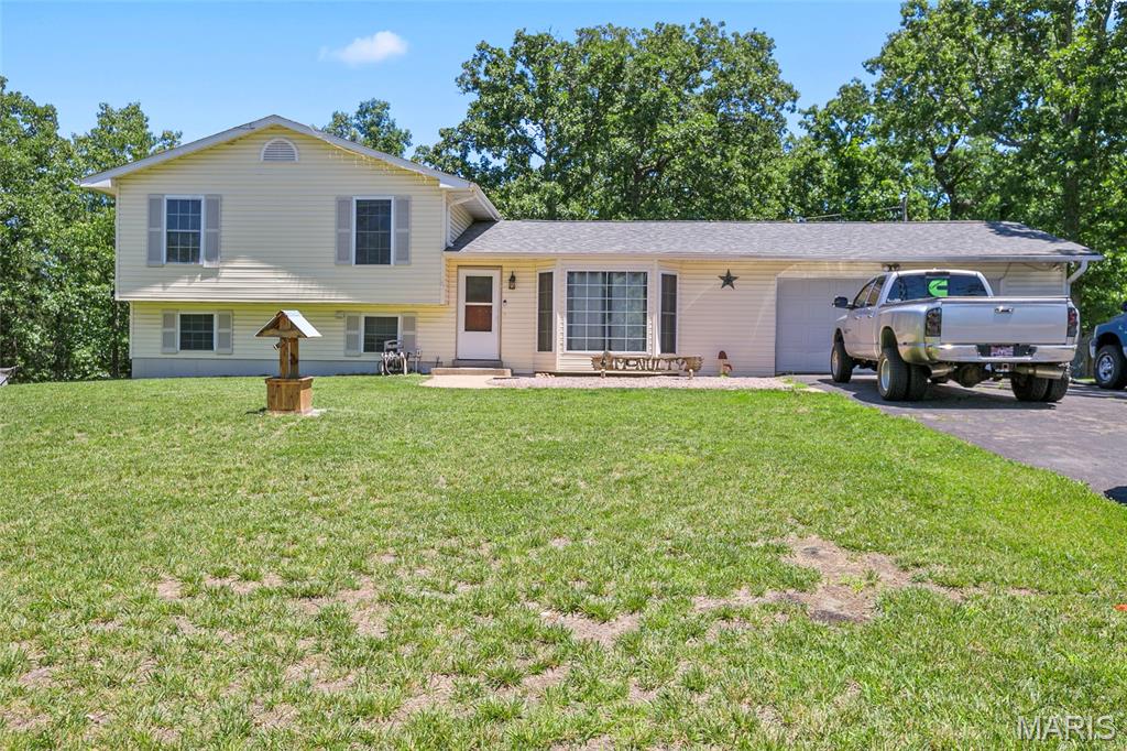 Don't miss your opportunity to own this beautiful 4-bedroom, 2-bath home situated on a double lot totaling over an acre in the sought-after community of Terre du Lac! This well-maintained home features plenty of space for comfortable living.
Step outside and enjoy the large 20' x 20' deck overlooking the fenced backyard, offering plenty of room for pets, play, gardening, or entertaining. Inside, the spacious family room showcases a stunning tongue-and-groove pine ceiling, recessed lighting, and new carpeting, creating a warm and inviting atmosphere.
With over an acre of land, you'll have the privacy and outdoor space that's hard to find in a lake community. As a resident of Terre du Lac, you'll enjoy access to an incredible selection of amenities, including 15 lakes, boating, fishing, beaches, parks, and more.
Experience the perfect blend of space, comfort, and lake community living—schedule your private showing today!

Please note when entering into GPS for directions please enter 1809 Stoney Point Rd Bonne Terre MO 63628.   If you enter the property address, it will not take you to the correct location.