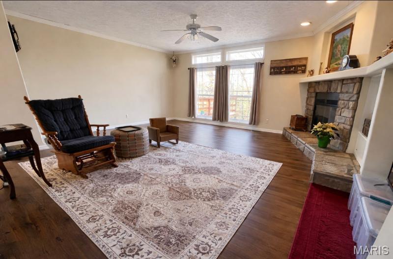 Price Improvement! Very attractive 1,800 sq. ft. modular home, with metal roof, built in 2006. This 3 bedroom, 2 bath home has a gas log fireplace, recessed lighting,large rooms, new carpeting.Primary bedroom has a garden tub and a walk-in shower, along with a walk-in closet. tilt out windows, CH/A, arched doorways, very nice kitchen,  oven/range/ dishwasher/microwave, refrigerator,pantry,with island. New 1,000 gal. septic,Outside there is a deck to enjoy your coffee on, and a  storage shed. All sitting on 1.1 acres m/l and on a paved highway. Call to view this very nice home.