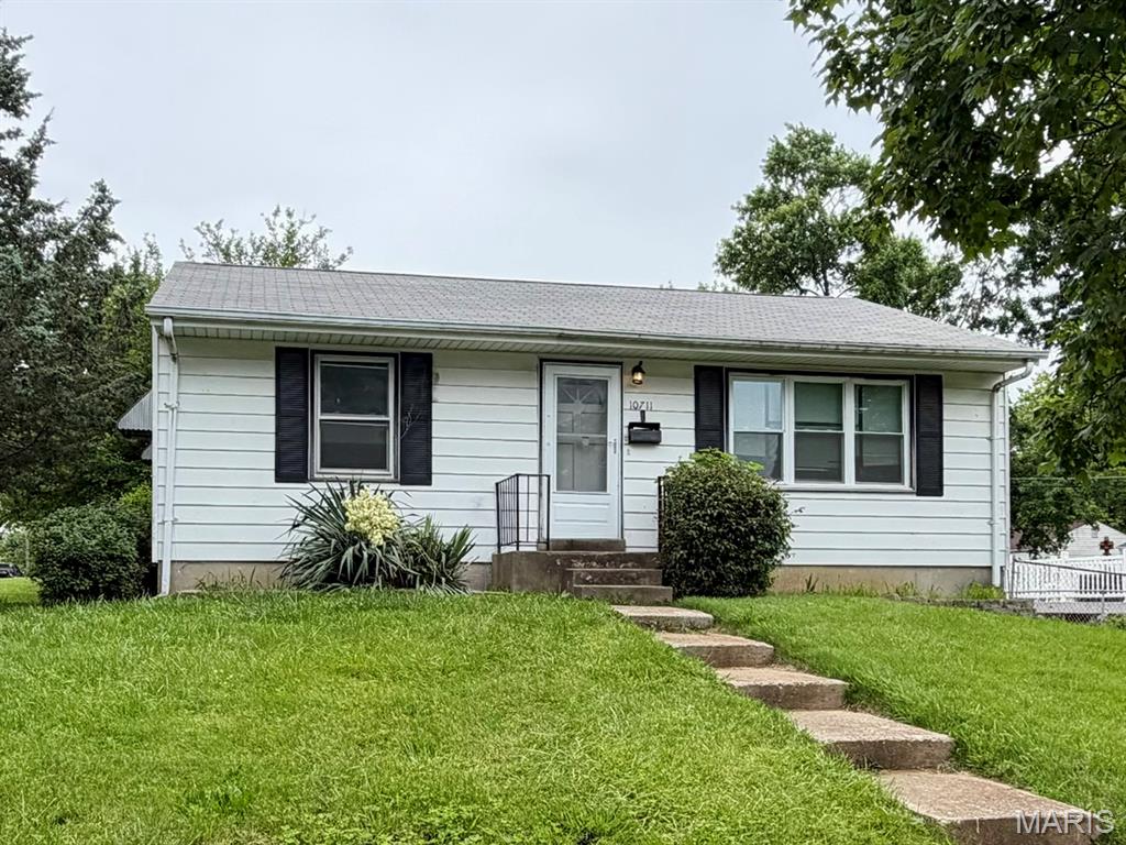 Investor Special in Saint Ann! This 2-bedroom, 1-bath home offers a great opportunity for investors, rehabbers, or buyers looking to add value. Features include a private driveway, full basement with ample storage and a bonus sleeping area or recreation room, plus hardwood floors. Newer HVAC system (2022). Convenient Saint Ann location with solid potential for rental income, resale, or sweat equity. Bring your vision and unlock the possibilities!