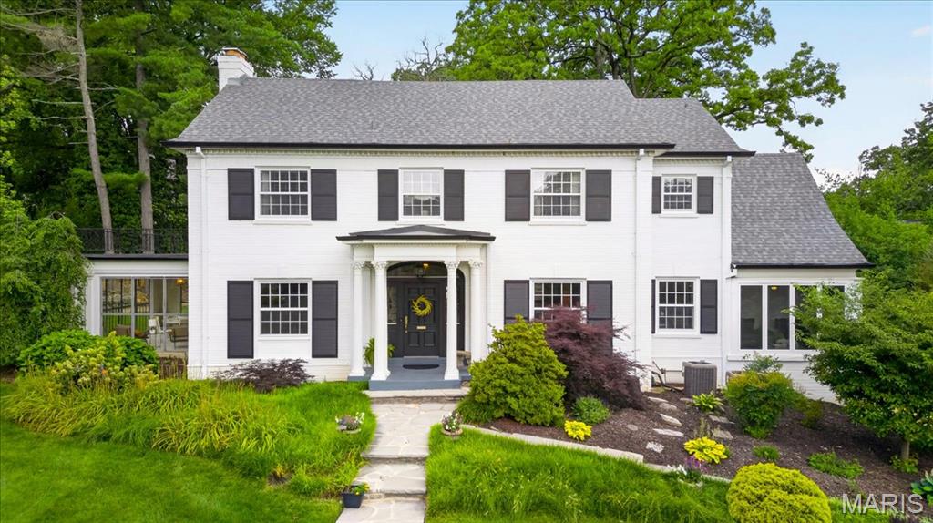 Sitting atop Sherwood Forest, on an incredible lot in one of Webster Groves' most iconic neighborhoods, 465 Sherwood Dr. is a classic Colonial-style home that perfectly balances timeless architecture with modern updates. The center hall floor plan separates the formal living and dining rooms, preserving the character and elegance that make homes like this so enduring. The kitchen has been thoughtfully updated with high-end appliances and carefully selected finishes. And that view from the window! It's the perfect preview of what awaits out back.

These inviting spaces create a home designed for both everyday living and effortless entertaining, anchored by a comfortable family room addition overlooking the backyard. The second floor includes 3 spacious bedrooms and 3 full baths, while the third floor offers a private 4th bedroom suite with its own (4th) full bath.

Step outside and discover what truly makes this property special. The backyard feels like a private retreat, anchored by a stunning in-ground pool, expansive patios and multiple spaces for gathering with family and friends. Whether hosting summer pool parties, enjoying dinner under the covered porch or simply watching the kids play in the yard, there is room for everyone. The beautifully landscaped grounds offer an extraordinary amount of usable green space rarely found in Webster Groves, creating a setting that feels both private and welcoming. Mature trees, sweeping lawns and thoughtfully designed outdoor living spaces combine to create one of the neighborhood's most memorable backyards—a place where family traditions are made, celebrations are shared and memories are created for years to come.
