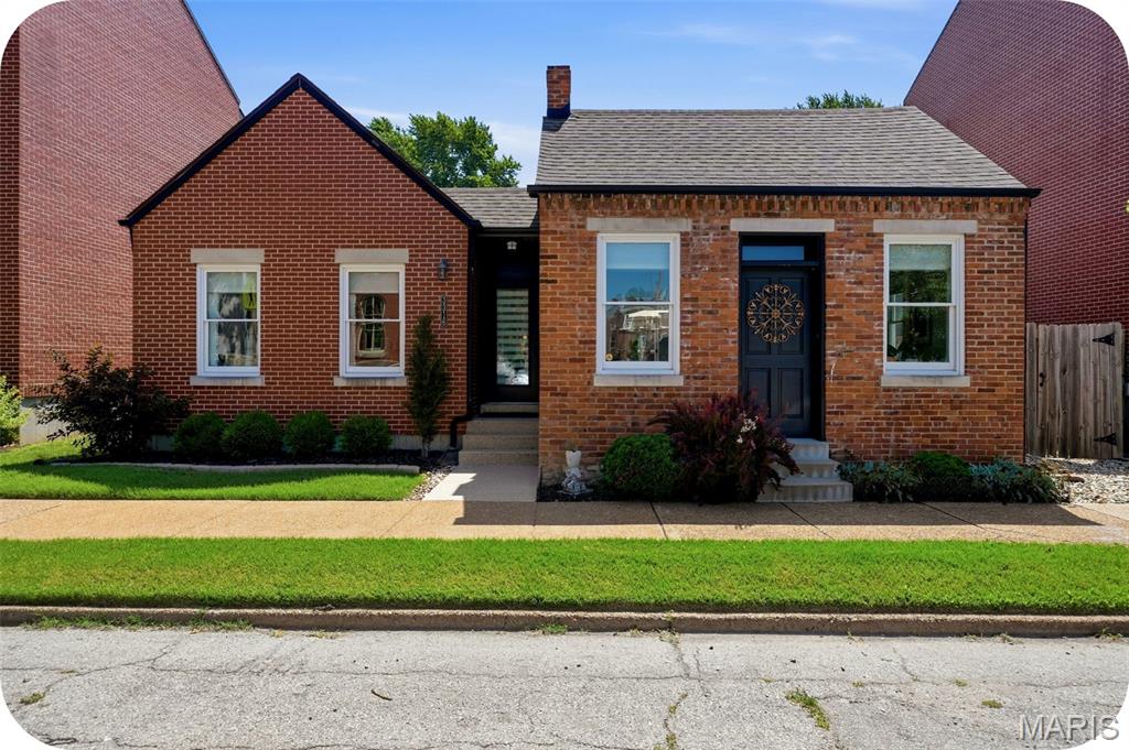 Every once in a while, a home comes to market that simply can't be compared to anything else. This extraordinary home incorporates an original 1879 historic cottage rumored to have served as a stop on the Underground Railroad. Through an extensive architectural restoration, it was thoughtfully transformed into a stunning energy-efficient residence that perfectly blends history with modern design. Created for effortless single-story living, this immaculate 3 bedroom, 2 bathroom home features wood floors, original exposed brick, fireplace, custom blinds, and high-end finishes throughout. At the heart of the home is a striking U-shaped floor plan centered around a private interior courtyard patio, creating an exceptional indoor/outdoor living experience with direct access from both the living room and kitchen area. The sleek, open kitchen is beautifully appointed with new quartz countertops, premium appliances, including an induction range, and abundant workspace for cooking and entertaining. Outside, the large and professionally landscaped, fully fenced backyard offers raised garden beds and a two-car garage. The poured concrete basement provides incredible expansion potential with tall ceilings, an egress window, and plumbing already roughed in for a future bathroom, making it ideal for adding another bedroom and additional living space. Meticulously maintained and truly unlike anything else on the market, this is a rare opportunity to own a home that seamlessly combines architectural significance, modern efficiency, and exceptional design in the heart of historic Benton Park.