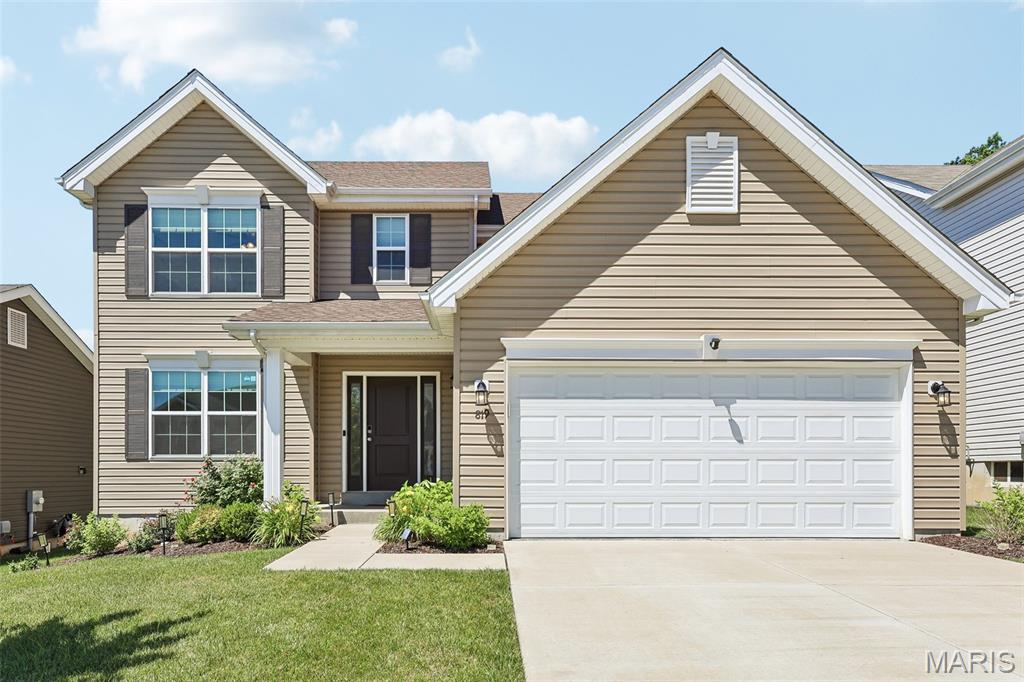 Spacious living and desirable amenities await you in this Fenton, MO home! Located in the sought-after Winding Bluffs subdivision, this 4-bedroom, 2.5-bath home offers over 2,500 sq ft of living space and a functional floor plan. An expanded entry welcomes you inside and is flanked by a versatile office that could also serve as a playroom, family room, or flex space. The spacious living room features a gas fireplace and flows seamlessly into the breakfast area and open-concept kitchen. The kitchen offers stainless steel appliances, solid surface countertops, pantry, and a large center island perfect for gathering and entertaining. A separate dining room provides additional space for meals and special occasions. Upstairs, the primary suite features a large walk-in closet and private bath with double sink vanity, jetted tub, and separate glass shower. All four bedrooms include walk-in closets, and the hall bath has been upgraded with a walk-in shower. Main-floor laundry includes built-in cabinetry and is conveniently located near the garage entry. The unfinished lower level offers a rough-in for a future bath and plenty of storage or finishing potential. Outside, enjoy the patio and irrigation system, while the 2-car garage includes a charging station for your electric vehicle. Additional features include a reverse osmosis system, water softener, ceiling fans throughout, and all major systems only 5 years old. Located just minutes from Gravois Bluffs, Highways 30 and 270, and neighborhood amenities including a dog park, walking trails, pickleball court, stocked lake, and sports field!