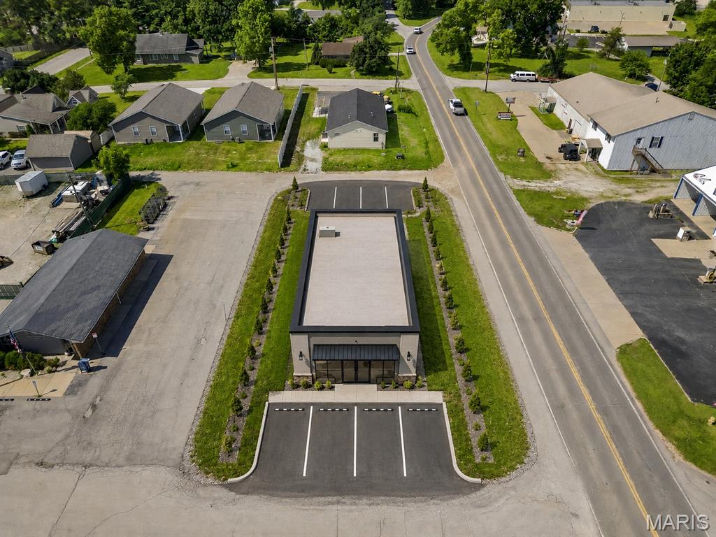 Exceptional development opportunity in the heart of Moscow Mills! This highly visible lot offers outstanding potential for an investor, builder or developer looking to create a signature mixed-use or income-producing property (subject to City approval). The zoning district allows buildings up to 35 feet (2½ stories), creating the opportunity to maximize the site's potential.  Located along a well-traveled roadway with excellent visibility and convenient access, this property is ideal for buyers looking to build and hold for long-term passive income. Whether you're envisioning boutique offices, a professional services building or a live/work concept, this property offers flexibility and strong investment potential. Buyers should verify all intended uses, development plans and site requirements with the City of Moscow Mills.