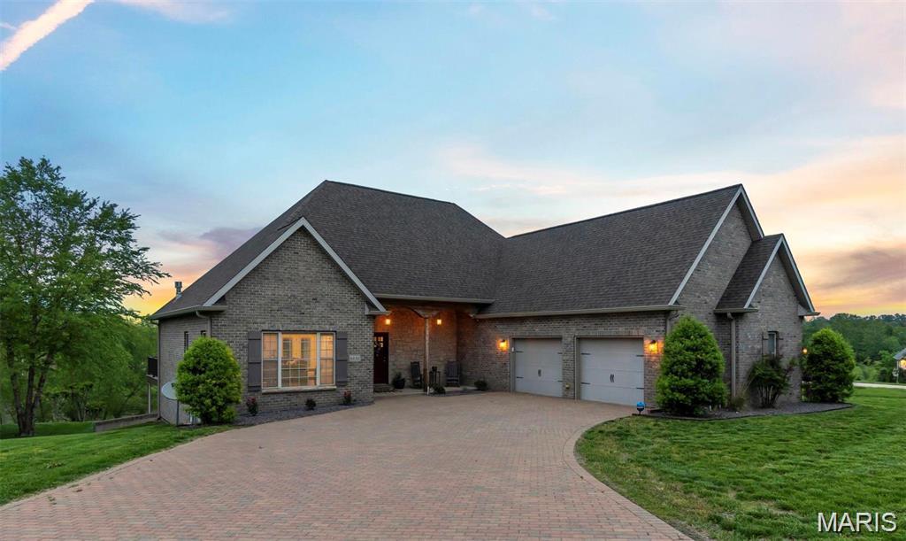 Nestled in a quiet cul-de-sac in desirable Dalhousie subdivision, this exceptional lakefront home offers breathtaking views of both the lake and the Dalhousie Golf Course. The spacious open concept floor plan is designed for comfortable living and effortless entertaining, with expansive windows and direct access to a large deck showcasing the stunning scenery. With over 5,000 square feet of living space, there is plenty of room for gathering and entertaining. The main level primary suite features picturesque lake views, its own access to the deck, a deluxe bath set up, and an impressive walk in closet.
The finished walkout lower level includes a newly remodeled entertainment area complete with a custom bar and large screen viewing space, perfect for game days, movie nights, and hosting guests. Basement also provides great office space! Step outside to the covered patio and the newly fenced backyard, ideal spots for barbecuing and relaxing. 
An upper level bedroom and private bath provide excellent separation and flexibility for guests, a home office, hobby space, or additional living quarters. The unfinished area even features a painted pickle ball practice court, offering a unique recreational opportunity right at home. The roomy two car garage has a hypoxied floor and accomodates large vehicles well.  This home is a rare combination of space, views, and amenities in one of Dalhousie's most sought after locations!