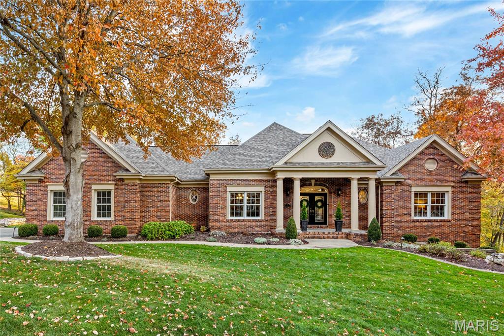 Spectacular full-brick atrium ranch built by JL Wise, ideally situated on the grounds of Whitmoor Country Club. This Homer Award–winning home showcases exquisite trim work, custom built-ins, and oak hardwood floors throughout the main and lower levels. A dramatic covered porch with architectural columns and leaded-glass double doors opens to the formal dining room and an impressive great room featuring a marble fireplace, flanking built-in bookcases, and expansive windows overlooking the 10th hole of the South Course. The designer kitchen offers custom knotty alder cabinetry, granite countertops, premium appliances, and flows seamlessly into the sun-filled breakfast room with atrium doors leading to a private trex-deck. The spacious primary suite features a wide bay window and a luxurious bath with shower spa and freestanding soaking tub. An additional ensuite bedroom completes the main-level living quarters. The walk-out lower level includes a recreation room with floor-to-ceiling brick fireplace and wet bar, bedroom, guest suite. Set on a half-acre cul-de-sac lot with two trex-decks, a paver patio, and hot tub, this home offers exceptional indoor-outdoor living in a premier golf community.