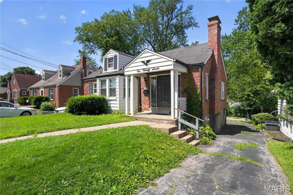 Discover the charm of this inviting Ferguson bungalow, perfectly blending classic character with comfortable living. This home features a bright living room anchored by a cozy wood-burning fireplace and a spacious bay window. With two well-sized bedrooms and beautiful hardwood flooring throughout the main level, it offers a functional, easy-to-manage layout. The eat-in kitchen leads to a generous, fully fenced backyard, ideal for outdoor enjoyment.