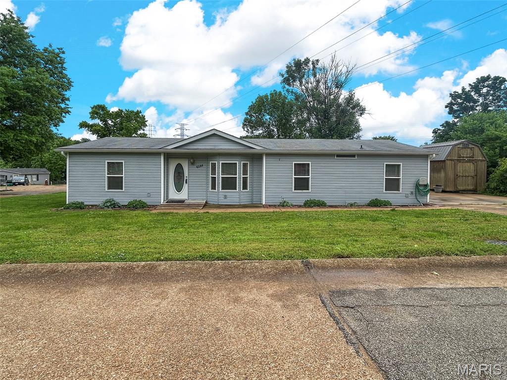 $10,000 Price Drop! Back on market due to financing issues. Beautiful, spacious manufactured home with divided floor plan.  Very open with living room and family room that features gas fireplace.  Main Floor Master Bedroom Suite with full bath.  Vaulted ceilings.  Stainless Steel Appliances.  Main Floor Laundry.  Large deck off back of home with 3 large storage sheds.  Home has been well loved. Seller wants to sell as-is.