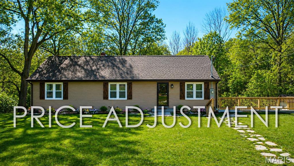 COMPLETELY REBUILT! Rare opportunity - Beautifully rehabbed 3 bedroom ranch home with an exceptional location on over 2.8 acres including an attached two car garage, new roof, an outbuilding AND a huge brand new back deck with two sets of stairs. You will love the updated and thoughtful finishes throughout! New roof-windows-new electrical-new installation JUST to name a few . As you enter the inside, you'll be greeted by warm flooring, high ceilings and a great open flow. Stunning fireplace in the living room! Dining area has double doors to the back deck and also connects to the BEAUTIFUL, spacious kitchen with all brand new appliances featuring built-in microwave, hood and all Cafe appliances. Custom cabinetry and quartz countertops round up your kitchen area. Main floor primary bedroom has double doors, double closets and connects to the upstairs loft room - a great space which could be used as an office, playroom, dressing room or even as an additional sleeping room! Full bathroom has ample room for you and your family. Two sizable bedrooms and an additional half bath complete the main level. For more living space you could finish the lower level. This basement features a walkout and lots of storage space! Outside you'll find lots of gardening space, playground areas, lots of privacy and beautiful wooded views. Great backyard with endless options, add a pool/ hot tub or even an outdoor kitchen! Conveniently located between the 2,000 acre Creve Coeur Park & Lake and the very nice Maryland Heights Community Rec Center, AAA Parkway schools with McKelvey Elementary School, close to all shopping, restaurants and quick highway access! You do not want to miss it - this is a one of kind home. CALL NOW!
