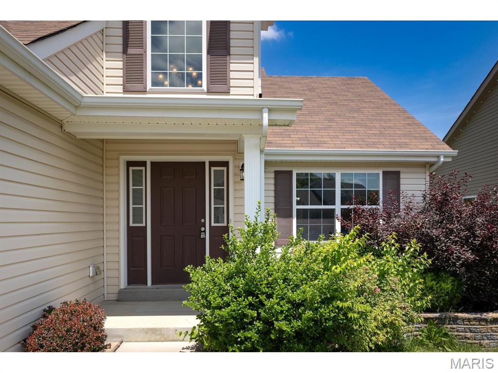 Image your fantasy in this limited edition 1 1/2 story newer home that is close to everything!  You can live in this home now and you can live in it for the long haul.  This home has incredible flexibility.  You can have the privacy of a main level primary suite while the kids are safely tucked away on the upper level.  If you want more, you can finish the lower level with walk out that already has a full bath rough and gain about 1,000 square feet more.  You can linger in this home as time goes on utilizing the main level primary suite with the 2nd level always ready for guests.  Because you are just a hop, skip and a jump from 141, you can get to I-64, I-44 or I-55 that will take you to directly anywhere.  You cannot build this less than 10 year old home for anything close to the asking price and when you design and add the custom deck of your dreams that backs to woods, you will have personalized your castle and enjoy serenity and livability at home.  So seize the moment and check out 255 Winding Bluffs Ct. before it is too late.