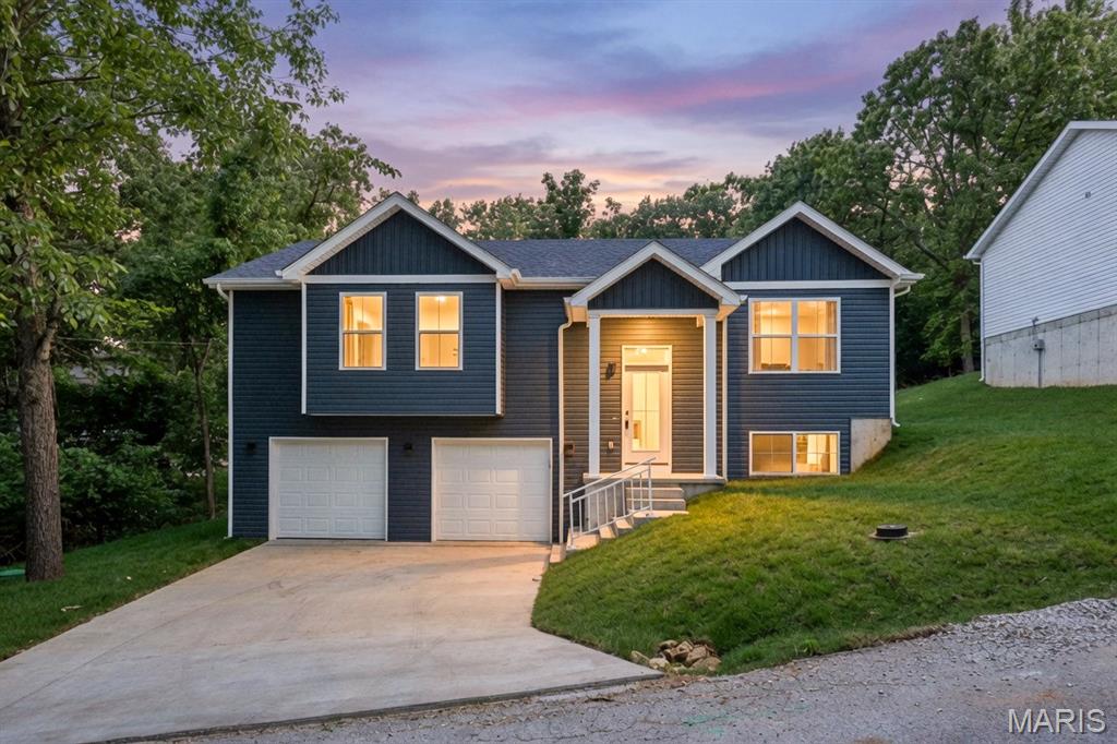 BRAND NEW CONSTRUCTION! 2-10 Home Warranty offered standard with all Velo Homes new construction homes. This astonishing modern take on a split foyer is ready for its first loving owner! Step through the front door and prepare to have your mind blown by the build quality. LVP throughout the common areas of the home. Beautiful and unique finishes that all collaborate (black with a brushed gold highlight) from lighting to cabinet handles to door knobs: the whole home shares a common theme. This home features 3 bedrooms and 2 full bathrooms. Over 1,250 square feet on the upper level. You'll love the open floor plan with the beautiful tan LVP flooring. The Dark grey cabinets offer plenty of storage and compliment perfectly with the stainless steel appliances. The double bowl farm sink is a beautiful dark grey complete with a sprayer nozzle and a garbage disposal. Keep your cabinets organized with the additional pantry area for food storage. The primary bedroom features a walk-in closet with a closet organizer as well as a on-suite primary bathroom. You'll love all the space and the separation of the primary from the other bedrooms. The primary bathroom boasts plenty of vanity space, a stand up shower with high mounted shower head, linen closet, and the walk in closet you've been dreaming of! The other bedrooms have beautiful natural lighting, plenty of space and share the hall bathroom. The lower level is unfinished with 500+ square feet of additional living space potential with an egress window (Make an additional bedroom if you would like!) Full bath in the lower level is already roughed in by the builder. Double carriage doors welcome you into your spacious 25X23 2-car tuck under garage extremely convenient for grocery store runs! The front yard is sodded and the back yard is already seeded and strawed. Composite deck 8X7 with wrought iron railing walks down to a concrete patio giving you the perfect start to all of your outdoor entertaining activities! Why wait for a new construction home to be built when you have your newly built dream now!