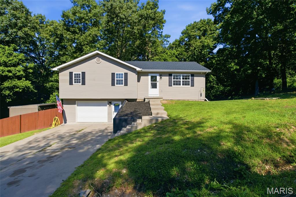 Welcome home to comfort, convenience, and easy living in the heart of St. Robert! Ideally located just minutes from the Fort Leonard Wood Main Gate, this well-maintained 3-bedroom, 2-bath home offers the perfect blend of functionality and modern updates. Step inside and you'll immediately appreciate the warm, inviting atmosphere created by the durable luxury vinyl plank flooring that flows throughout both the main level and basement. The spacious living areas provide plenty of room to relax, entertain, or simply enjoy everyday life. The kitchen is equipped with newer appliances, making meal preparation a breeze while offering a clean, updated feel. Outside, the newer privacy-fenced backyard creates a peaceful retreat where you can enjoy morning coffee, host weekend barbecues, or let pets and children play freely. A storage shed provides additional space for lawn equipment, tools, seasonal decor, or outdoor hobbies, helping keep everything organized and within reach. Whether you're looking for a quiet place to unwind or a space to gather with family and friends, this backyard is ready to fit your lifestyle. The large garage offers ample room for vehicles, storage, tools, or hobby space. Downstairs, the basement presents an additional extra-large living space to stretch out and relax. With its prime location near shopping, dining, schools, and Fort Leonard Wood, this move-in-ready home offers the lifestyle you've been looking for. Schedule your private showing today and discover all the possibilities this wonderful property has to offer!