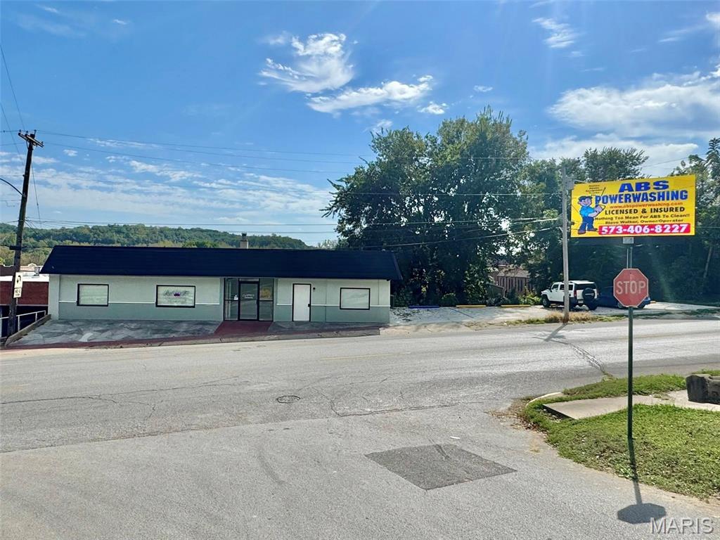 Fully updated and move-in ready, this high-visibility commercial building offers unmatched exposure sitting on one of Hannibal's busiest traffic corridors, Broadway! Inside, you'll find high end & versatile office space that practically every single inch of has been quality renovated. Additional upgrades include new Central AC and a forced air gas furnace, security surveillance system, plus a freshly poured 72'x24' concrete parking lot with 6 dedicated spaces. The basement level of this property expands your possibilities, offering 2 drive-in garage doors plus 2 additional storage bays which are ideal for inventory, workshop space, or fleet vehicle parking. If "location, location, location" had a definition, it would be this building!