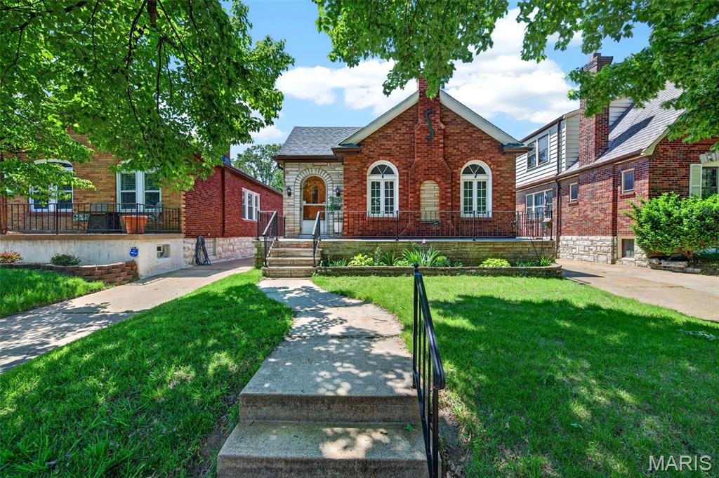 ABSOLUTELY ADORABLE Bungalow Nestled in the Heart of Holly Hills! This beautifully preserved Brick and Stone home showcases the quintessential St. Louis charm buyers love — Gorgeous Hardwood Floors, Rich wood trim, French doors, Crystal Doorknobs, Curved Archways, & Tall Ceilings Throughout. A Wide Front Porch welcomes you inside to spacious, Light-Filled Rooms & a warm, inviting layout. The Bright Sunroom overlooks the Fully Fenced Level Backyard, while the Partially Finished Walk-up Basement offers a Generous Rec room/Office & Separate Laundry area, Epoxy Flooring, & Excellent Storage! Major updates include a New Roof (2022). Updated Kitchen, Bath, Windows, Plumbing, & Electrical within the last 10 years. A driveway leading to a street-facing garage & provides convenient off-street parking.

Just two blocks from 180-acre Carondelet Park! Enjoy Walking & Biking Trails, Tennis Courts, Fishing ponds, & The Beloved Summer Concert Series. You’re also moments from the Carondelet Rec Complex with an Outdoor Pool, Fitness Center, & Year-Round Activities. With Fantastic Schools, restaurants, grocery, and I-55 nearby — & wonderful neighbors all around — this Holly Hills gem blends timeless character with meaningful updates in an unbeatable location!