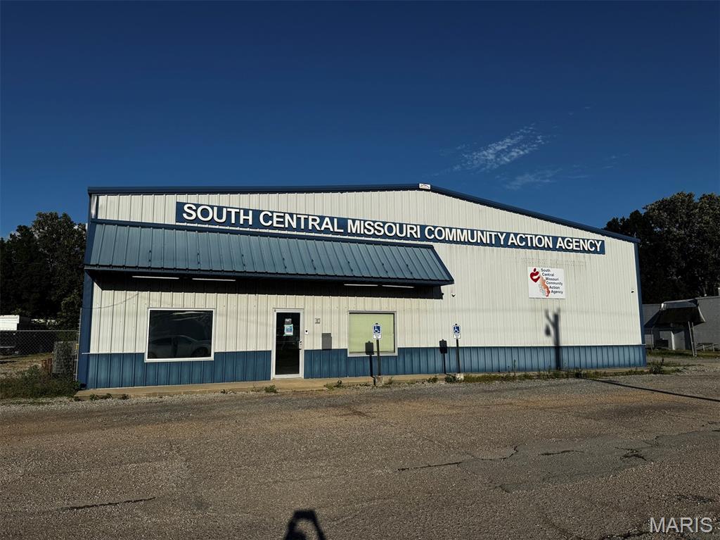 Exceptional opportunity to own a versatile commercial building designed to accommodate a wide range of business operations. Measuring approximately 70’ x 125’, this well-maintained property offers an ideal combination of office, warehouse, and storage space.

The front 37’ x 70’ section is fully finished on two levels and spray-foam insulated for energy efficiency. The main level features a welcoming reception/foyer area, four private offices, a conference area, full kitchen/break room, and restroom. Upstairs includes two additional private offices, two large open workspaces, and a second restroom.

Multiple zoned, all-electric HVAC systems provide efficient climate control throughout the finished office areas.

The rear 88’ x 70’ warehouse section sits on a heavy-duty concrete slab with floor drain and includes approximately 2,700 square feet of storage space along with four oversized 14-foot overhead doors, making it ideal for equipment, inventory, manufacturing, or distribution needs.

Additional features include:

Fenced and gated storage area on the north side
Ample on-site parking
Flexible layout suitable for numerous commercial uses
Excellent combination of office, warehouse, and storage facilities
Whether you’re expanding an existing business, investing in commercial real estate, or seeking a multi-purpose facility, this property offers the space, functionality, and flexibility to meet your needs. Also available for lease at $3200 monthly.