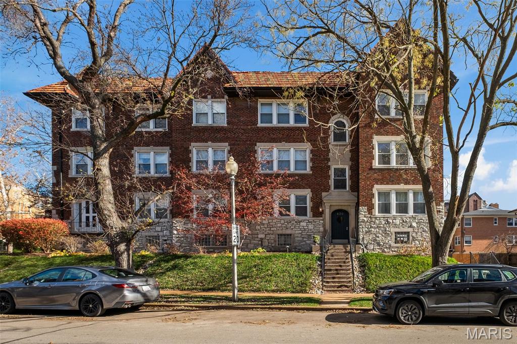 Location, location, location! Fabulous Clayton condo in sought after Moorlands neighborhood has it all! Easy living at its finest, this 2 bedroom gem is within walking distance of sumptuous Downtown Clayton eateries and just over a mile from the gorgeous Wash U Campus. This idyllic 2nd floor corner unit features scenic views, stunning refinished original hardwoods, gorgeous crown molding, Hunter Douglas blinds throughout, beautiful arched entryways and relaxing sun-drenched spaces. An open floorplan seamlessly connects the living & dining area, and the stylish kitchen is well-equipped with newer stainless appliances, granite counters, abundant custom cherry cabinetry, large pantry, and a walkout to the covered deck. A marble top vanity takes center stage in the luxurious bath updated in 2019, while two spacious bedrooms w/walk-in closets featuring custom closet organizers, and an awesome office/bonus space round out this 1,289 sq ft beauty providing flexible living areas to accommodate your specific lifestyle. Want more? Reserved parking in the underground garage, private storage room, and a dedicated washer/dryer in the complex laundry room! Trash, water, sewer, snow removal, grounds maintenance & insurance are included in the HOA and did we mention easy highway access? New 2026 roof, 2018 HVAC with humidifier upgrade, and 2017 water heater. Students, outdoor enthusiasts, foodies, down-sizers, those working in the Clayton area or anyone ready to embrace easy living in a vibrant community better act fast; this Moorlands gem one won’t last long!