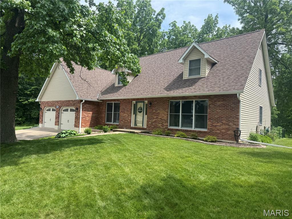 Warm, inviting, and meticulously maintained, this one-owner home is tucked away at the end of a cul-de-sac on nearly an acre of beautifully landscaped grounds. A home that feels welcoming the moment you step inside, it offers the perfect blend of comfort, space, and timeless appeal. Beautiful hardwood flooring greets you at the entry, with a quiet living room filled with natural light to one side and a formal dining room to the left.  It features 5-bedroom, 2.5-bath, 2 car garage, and unfinished basement. The heart of the home is the spacious kitchen and family room, designed for everyday living and entertaining. The kitchen offers Oak cabinetry, a built-in dishwasher concealed behind a matching cabinet panel, easy flow into the family room with vaulted ceilings, a stunning wood-burning fireplace, and large windows overlooking the backyard. The main-level primary suite features a private bath with 2 sinks, ceramic tile shower with glass doors. The office could easily serve as a bedroom, it has a closet. A 1/2 bath completes this level. Upstairs you’ll find three generously sized bedrooms, good closet space, and a walk-in closet in the hallway. The unfinished basement is plumbed for a third bath and offers endless possibilities for future living space, recreation, or storage. Outside, you’ll discover a true park-like setting. Mature shade trees, colorful perennials, thoughtfully designed landscaping, a fire pit gathering area, and a beautiful paver patio. Homes this well cared for, on a setting this special, don’t come along often. #lovewhereyoulive