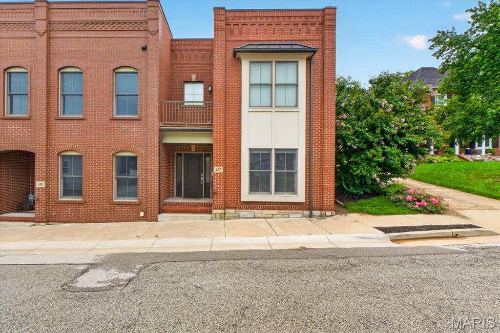 Rare opportunities like this are seldom available in Historic Downtown Washington. This exceptional townhome offers luxury finishes, thoughtful design, and an unbeatable location just moments from the Missouri River, riverfront walking trails, restaurants, shopping, and everything downtown has to offer. One of the home's most distinctive features is its direct walk out access to a private, fully fenced backyard, making it the only residence of its kind in the development to offer this unique outdoor living experience.

Inside, the home showcases expansive living spaces with soaring ceilings, oversized windows that fill the interior with natural light, and stained concrete flooring  that adds a modern industrial aesthetic to the main living spaces. The spacious primary suite is a true retreat, featuring a custom walk in closet, private balcony, and a beautifully appointed ensuite bath with dual vanities, stone countertops, and a walk in glass shower. The additional bedroom is generously sized and continues the home's modern design with quality finishes and ample storage.

Designed for both everyday living and entertaining, the home offers an open and functional layout complemented by a dedicated laundry room with built in workspace and storage, custom closet systems, and premium fixtures throughout. The combination of contemporary construction, timeless brick architecture, and low maintenance living creates an exceptional ownership opportunity in one of Washington's most desirable neighborhoods.

Whether you are looking for a primary residence or a lock and leave lifestyle without sacrificing space or quality, this home delivers a level of design, privacy, and location that is rarely found. With its exclusive backyard access, refined interior finishes, and premier Historic Downtown Washington setting, this is an opportunity that truly stands apart.