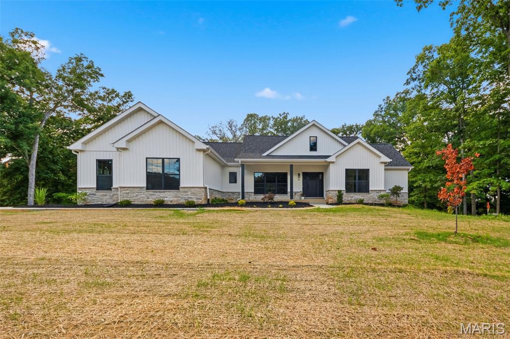Welcome home to this exceptional new construction ranch nestled on a picturesque 1.52+/- acre walk-out lot in the highly desirable Woods of Sandy Creek Subdivision. This beautifully crafted 3-bedroom, 2.5-bath home combines quality craftsmanship, modern design, and peaceful wooded surroundings. From the inviting covered front porch to the thoughtfully designed open floor plan, every detail has been carefully considered. The spacious kitchen is the heart of the home, featuring a large center island, walk-in pantry, and seamless flow into the main living and dining areas—perfect for everyday living and entertaining alike. Retreat to the luxurious primary suite complete with dual vanities, a freestanding soaking tub, separate shower, and generous space to unwind. Additional highlights include a well-appointed laundry room with built-in cabinetry, an oversized garage with service door, and an expansive unfinished walk-out basement offering endless possibilities for future living space.

Step outside and enjoy the beauty of nature from the large maintenance-free covered deck or the covered patio below. Surrounded by mature trees and scenic views, this property offers the privacy and tranquility you've been searching for while still enjoying the convenience of paved subdivision streets and a desirable neighborhood setting.

A rare opportunity to own a stunning new home on acreage—schedule your private tour today.