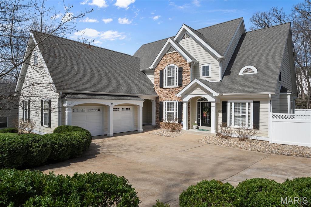 Prepare to be impressed in over 4,400 square feet & a .35-acre lot of gorgeous living!
Exceptional opportunity to live and thrive in a vibrant community known for top-rated schools, picturesque parks, acclaimed restaurants, and a beloved Farmers Market. This stunning 1.5-story residence blends timeless elegance with modern comfort, offering 5 bedrooms and 4.5 baths designed for both refined entertaining and effortless everyday living.
From the grand two-story entry, you’re welcomed by exquisite millwork, soaring volume ceilings, hardwood floors, and thoughtfully designed spaces, including a private office, vaulted dining room, and a desirable main-floor laundry and mudroom. The open-concept chef’s kitchen is the heart of the home, showcasing abundant custom cabinetry, a walk-in pantry, an expansive center island, and stainless steel appliances that flow seamlessly into the inviting family room. The main-level primary suite is a true retreat, featuring floor-to-ceiling windows with serene backyard views, a spa-inspired bath with dual vanities, a glass-enclosed shower, a jetted tub, and a custom walk-in closet.
Upstairs offers three spacious bedrooms, including a Jack-and-Jill bath and a private ensuite. The finished lower level is an entertainer’s dream with expansive living areas, a fifth bedroom, full bath, and generous storage, with direct access to the screened porch and outdoor living.
Enjoy a beautifully fenced yard, irrigation system, and an updated composite deck—perfect for relaxing or hosting in style. Welcome Home!