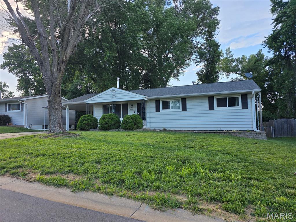 Two levels of living in this ranch style home with an attached two car carport. Special features include: wood floor, updates to the kitchen cabinets with granite countertops, enclosed rear porch off the kitchen,  updates to both bathrooms and so much more! Main floor has living room with wood burning stove, kitchen with eating area, three bedrooms and one full bath. The lower level has recreation room, office/bedroom and a full bath. Easy to show! Set your appoinemtn today!