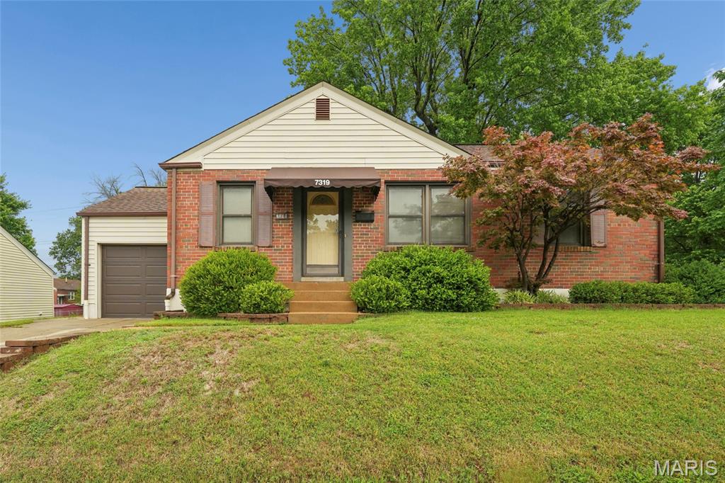Welcome to this charming brick beauty, perfectly perched on a large corner lot in the highly desirable Boulevard Heights neighborhood! Offering over 1,500 square feet of total finished living space, this 2-bedroom, 2-full bathroom home is packed with character and ready for its next owner. The bright and airy main level welcomes you with hardwood floors, abundant natural light, and a spacious living area. Whip up your favorite meals in the generous eat-in kitchen, featuring durable tile flooring and plenty of cabinetry space. Down the hall, you'll find two comfortable bedrooms and a full bath that perfectly preserves its vintage charm with classic "South City" tile. Need more space? Head downstairs to the expansive, bright finished basement that doubles your living area! Complete with a cozy family/recreation room, a large walk-in closet, a second full bathroom, and a dedicated laundry/storage room (washer and dryer included!), the possibilities here are endless. Step outside to your own private oasis. An expansive deck overlooks the landscaped yard with mature shade trees. A newly added privacy fence ensures a safe haven for pets and play. Complete with a 1-car garage, private driveway, and undeniable curb appeal, this home is ready for its next chapter.
