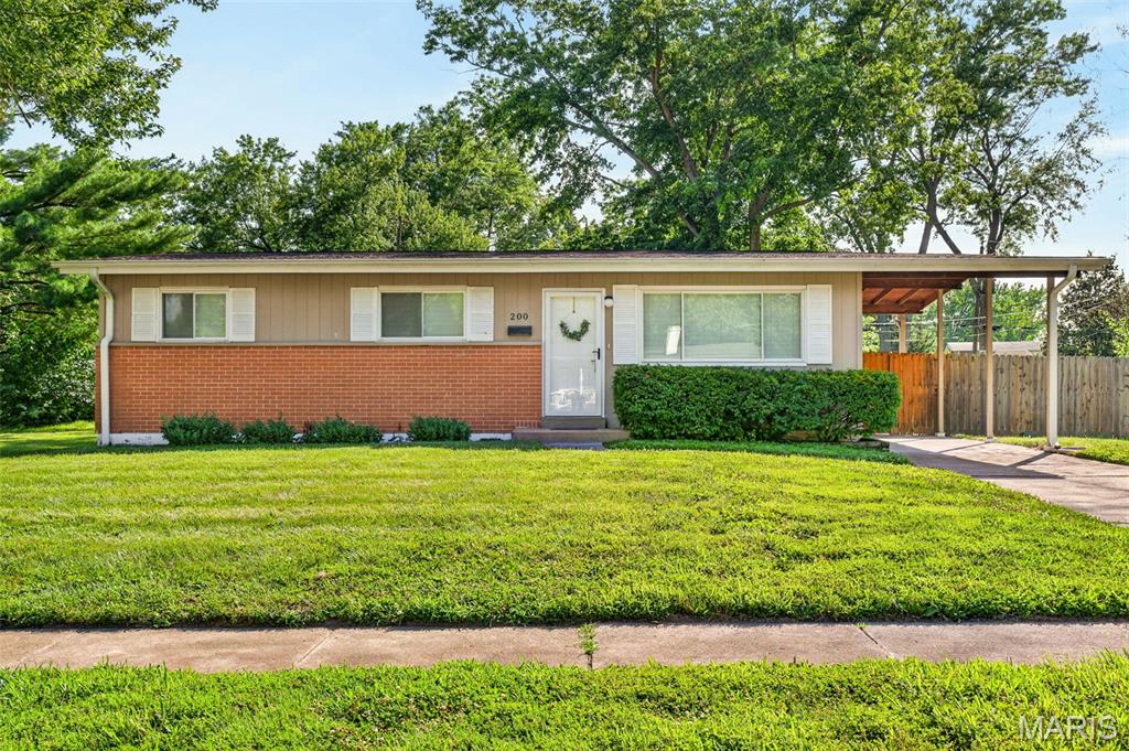 Welcome home! This well-maintained ranch offers comfortable one-level living with a bright, inviting layout and plenty of natural light throughout. The spacious living room flows into an eat-in kitchen featuring white cabinetry, stainless steel appliances and plenty of room to gather. Updated lighting and fresh, neutral finishes make the home feel clean and move-in ready, while the bedrooms offer comfortable space and ceiling fans.

The updated bathroom features modern finishes, a stylish vanity and a tiled tub surround. Outside, you'll find a fully fenced backyard with plenty of room to relax, entertain, garden or let the pups run. The covered carport and patio area add even more functional outdoor space.

Cute, clean and ready for its next owner—schedule your showing today!