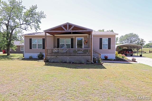 Located in Kelly School District.  Tucked away down a quiet country road, this like-new 2022 manufactured home offers the perfect blend of peaceful country living and modern comfort! Situated on a beautifully manicured 3/4 acre lot, this meticulously cared for 3 bedroom, 2 full bath home is move-in ready and loaded with charm.


You’ll love relaxing on the giant covered front porch deck or entertaining on the covered back deck while enjoying all of the peaceful surroundings. Inside features a spacious open layout with a beautiful master suite complete with a large walk-in closet and private master bath. The home has been exceptionally maintained and still feels almost brand new!


Outside offers plenty of room for vehicles, hobbies, and storage with a large double carport with attached storage building. If you’ve been searching for a clean, well-kept home in a quiet country setting, this one checks all the boxes!