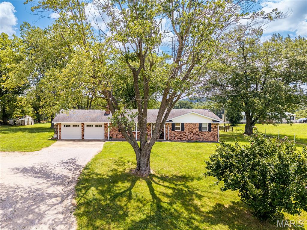 Discover the perfect place to grow in this charming 3-bedroom, 3-bathroom home nestled along State Hwy D. Offering 1,847 square feet of comfortable living space, this residence is thoughtfully designed for a growing family. Spacious interiors provide room to gather, relax, and create lasting memories. Step outside to enjoy generous outdoor space, ideal for children to play, weekend barbecues, or simply soaking in the peaceful countryside surroundings. Set in a serene rural setting yet conveniently accessible, this new listing blends tranquility with everyday practicality. Don't miss your chance to call this welcoming property home!