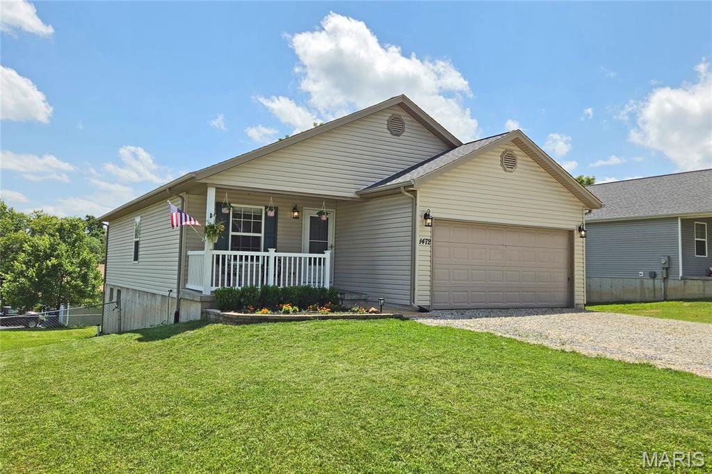 Enjoy the perfect blend of peaceful surroundings and everyday convenience in this beautifully maintained ranch.  Built in 2009 and topped with a brand new roof this summer, this turn-key home is ready for its next owner.  A covered front porch welcomes you inside to an open concept floor plan, featuring a spacious living room flowing seamlessly into the breakfast room and kitchen. The kitchen offers abundant cabinet and counter space, new stainless steel appliances and a layout designed for both everyday living and entertaining.  Step through the breakfast room's sliding glass door to the deck, overlooking the large fenced backyard.  The main level boasts a spacious primary suite with an en suite bath featuring double sinks and a linen closet.  Plus, two additional bedrooms, another full bathroom and the convenience of a main-floor laundry round out this floor.  The walk-out lower level adds a true fourth bedroom with a large egress window and walk-in closet.  The remaining space offers endless possibilities for a recreation room, home gym, workshop, storage and more.  Complete with an attached two-car garage, this home delivers the space, flexibility and carefree lifestyle you've been seeking; along with NO HOA restrictions to limit how you enjoy your property!