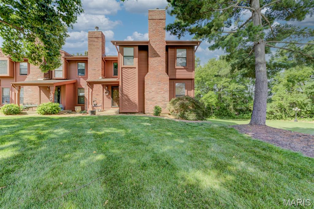 Welcome home to a beautifully maintained 1,777-sq ft townhouse offering comfort, style & serene natural surroundings. Fresh paint, warm neutral decor, rich stain package, updated lighting, custom blinds, new plush main-floor carpet & streams of natural light create an inviting atmosphere. Impressive open floor plan highlighted by stately staircase beneath a skylight & handsome woodburning fireplace anchors the living room. Dining room features charming bay window, elegant chandelier & convenient cut-out to the kitchen. Breakfast room & kitchen showcase striking wood flooring, wood cabinetry, stainless steel appliances w/updated disposal & enchanting garden window. Welcoming deck offers private retreat w/breathtaking views of mature trees and peaceful green space. Vaulted luxury primary suite offers walk-in closet & private balcony overlooking lush wooded backdrop, double sinks, whirlpool tub, separate shower, skylight & stunning stained-glass window. Two extra bedrooms, 2nd full bath & versatile second-floor laundry room complete the upper level. Well-lit basement provides excellent storage potential plus attached 2-car drywalled garage w/insulated door. Refrigerator & washer are included for added convenience. Recent updates offer tremendous peace of mind w/97%  Lennox HVAC (2022), water heater (2024), plumbing/toilets, Ring camera, smart thermostat & brand-new architectural roof in June 2026. Enjoy attractive landscaping, expansive green space, & quiet serenity surrounded by nature, just minutes from major roads, shopping, dining, and everyday conveniences. Residents also enjoy exceptional Community amenities: heated indoor pool, outdoor pool, fitness center, pickleball court, sauna & clubhouse. This outstanding property combines thoughtful updates, generous living space & resort-style amenities in a truly picturesque setting.