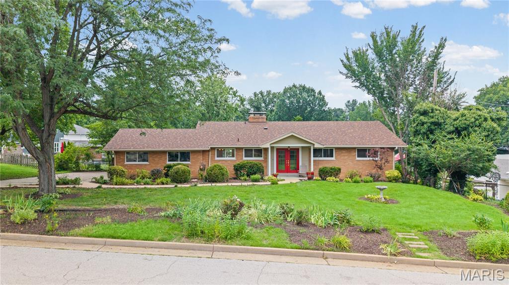 Beautifully updated 4 bed 3 full bath walk out ranch offers 2,500 sf of living space, 2 car side entry garage.  Enjoy the enormous park like fenced backyard which can be viewed from the wall of windows in the family room or lower level den. Totally custom kitchen features an abundance of cabinets and a hugh center island.  Finished lower level includes family room w 2nd fireplace, bedroom, full bath - additional room (could be bedroom or kitchen) work shop and storage areas - two sets of sliding glass doors.  Brand new roof featuring architectural shingles installed June 2026.   Truly a rare find.   Showings begin July 10 at noon.