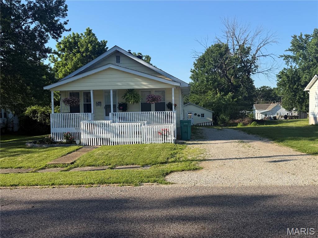 Beautiful 2 bedroom 2 bath home with walkout basement conveniently located in the city of Sullivan.  Freshly painted. Has a walkout basement that has full bathroom and extra living space. Has detached garage with backyard being partially fenced in.  Enjoy relaxing evenings on the welcoming front porch and take advantage of the backyard for the gardening area to the garage. Conveniently located just minutes from shopping, restaurants, ballparks and everyday amenities, with quick and easy access to major highways, this property offers the perfect blend of comfort, convenience, and value. Priced right, will not last long.. Call for your showing today.