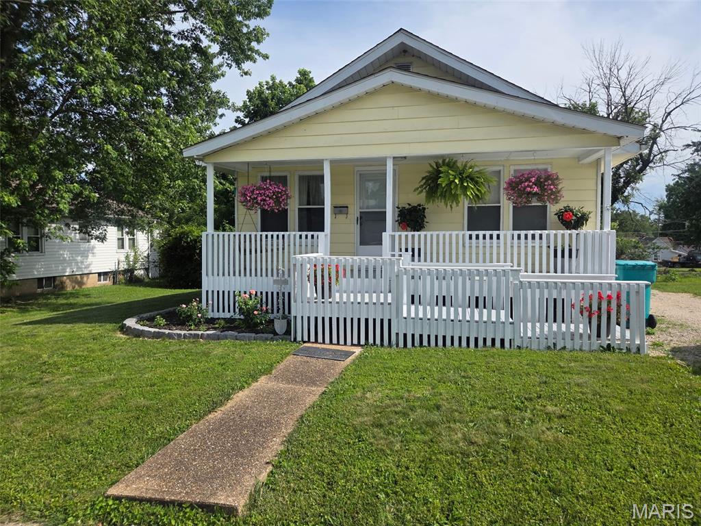 Beautiful 2 bedroom 2 bath home with walkout basement conveniently located in the city of Sullivan.  Freshly painted. Has a walkout basement that has full bathroom and extra living space. Has detached garage with backyard being partially fenced in.  Enjoy relaxing evenings on the welcoming front porch and take advantage of the backyard for the gardening area to the garage. Conveniently located just minutes from shopping, restaurants, ballparks and everyday amenities, with quick and easy access to major highways, this property offers the perfect blend of comfort, convenience, and value. Priced right, will not last long.. Call for your showing today.