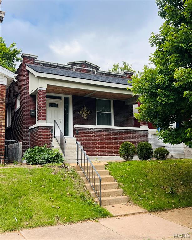 Charming brick bungalow in the heart of the Dutchtown neighborhood! This 2 bedroom, 1 full bath and 1 half bath home offers plenty of character and opportunity for the next owner. Features include a spacious living area, updated kitchen with open shelving and stainless steel appliances, full basement with a finished family room, and plenty of storage space. Enjoy relaxing on the large covered front porch or entertaining in the fenced backyard with convenient alley parking. Great South City location close to parks, restaurants, shopping, and major highways. Property is being sold AS-IS; seller to do no inspections, repairs, or warranties. Great opportunity for an owner occupant or investor looking to add their personal touch!