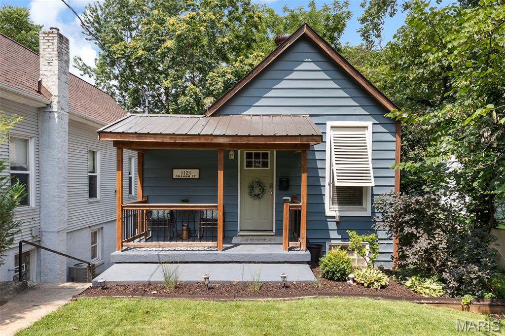 Welcome to this adorable, fully updated bungalow in the highly sought-after Dogtown neighborhood, just minutes from Forest Park, the Saint Louis Zoo, Art Museum, Washington University, and Barnes-Jewish Hospital. This charming two bedroom, one bath home features a unique and functional floor plan, with the kitchen and living room on the lower level offering easy walk-out access to the spacious backyard. The main level includes two bright, comfortable bedrooms and an updated full bath. Filled with natural light, the home offers a cheerful atmosphere, a large fenced backyard perfect for entertaining or relaxing, and convenient off-street parking. A brand new roof installed in 2025 adds even value and peace of mind. Whether you're a first-time homebuyer looking for a move-in ready home in an unbeatable location or an investor seeking an excellent addition to your short-term rental portfolio, this Dogtown gem is one you won't want to miss!