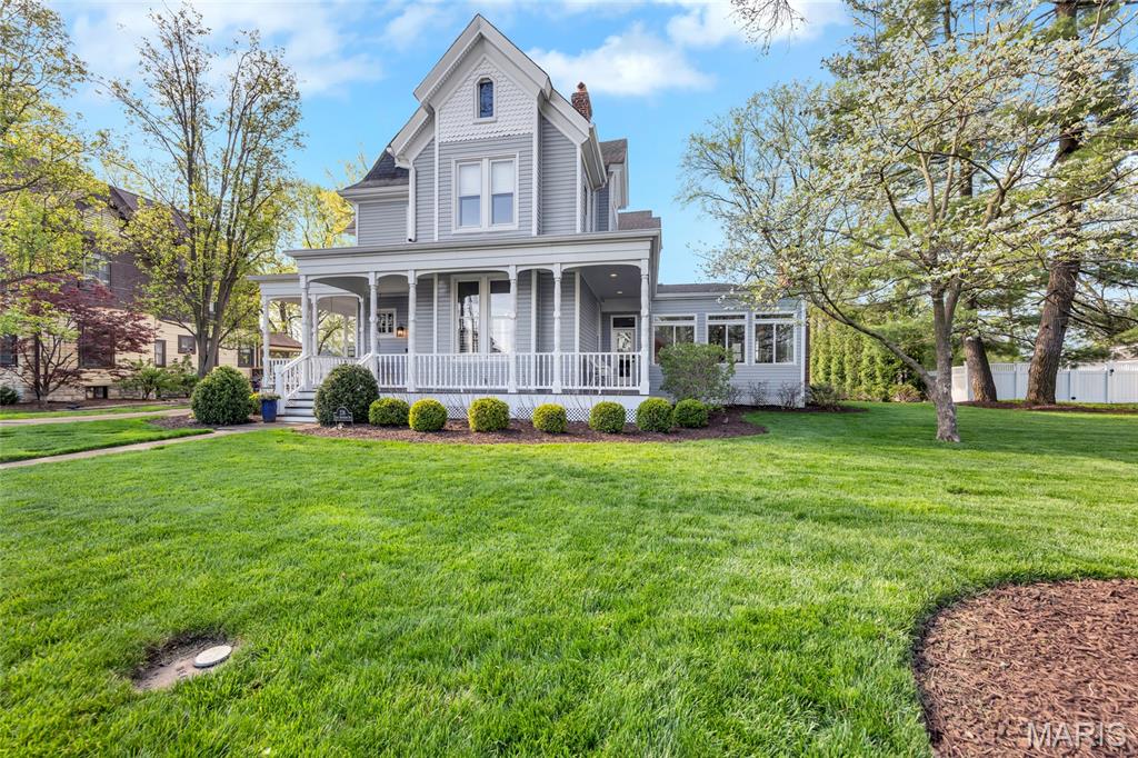 Timeless 1875  Victorian just steps from Downtown Kirkwood offering over 7,000 sq ft of total living space (6,200+ above grade). This beautifully updated home blends historic elegance with modern functionality and is anchored by 5 fireplaces, soaring ceilings, and original architectural detail throughout.
A gracious wraparound covered front porch welcomes you into expansive, light-filled living spaces designed for both everyday living and entertaining. The heart of the home is a spacious gourmet kitchen with generous prep and gathering areas, opening to inviting living spaces and a formal dining room ideal for hosting. A standout feature is the sunroom with indoor kitchen, seamlessly connecting to a large deck, patio and private, tree-lined backyard—perfect for indoor/outdoor living.
The home offers 6 bedrooms and 8 bathrooms, including a luxurious primary suite with spa bath, soaking tub, separate shower, oversized walk-in closet with private laundry, and a see-through fireplace shared between the bedroom and bath. Three additional bedrooms feature en-suite baths, a 4th & 5th bedroom and a lovely full hall bath, providing flexibility for family, guests, or office use.
The finished lower level expands living space with a family/game area and a separate exercise or craft room. Additional highlights include a 4-car garage, new main-level laundry, whole house generator, basketball court, multiple gathering spaces, and many upgrades ( see attached list)
Situated in one of Kirkwood’s most desirable locations, this home is just moments from shops, restaurants, the Kirkwood Farmer's Market, Library, and the Kirkwood Performing Arts Center, offering a rare combination of historic character, modern amenities, and walkable convenience!