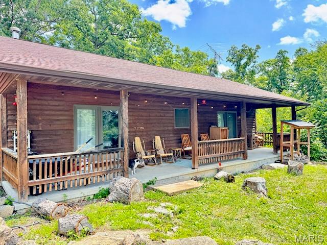 Spacious 3-bedroom 2-bath lakeview cabin at Pinnacle Lake!  Home offers plenty of room for family and friends, with a flow towards entertaining. Living room, dining room and kitchen are all open to one another so nobody's left out of the fun. The living room features a woodburning stove, built in bar and wine cooler, dining area will easily fit an 8–10-person table, kitchen meshes well and features breakfast bar, space for future dishwasher, newer stove and microwave, plus door to deck, and a utility room that is conveniently accessed from kitchen and hallway.  At the end of the day, you'll enjoy the privacy of this split bedroom design. Tucked down the hall you discover the large master suite sporting dual walk-in closets, full bath, and access to the covered porch. The opposite end of the home features 2 more bedrooms and another full bath. The walk out basement is set up with an entry door, window and an overhead door for lake toy storage. All this sitting on 3 lots totaling just under an acre. The perfect lake getaway or live the lake life year-round.