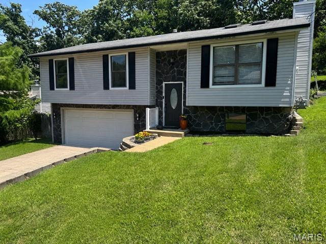Tucked away on a quiet cul-de-sac in the heart of Arnold! This spacious split level features vaulted ceilings, a wood burning fireplace, stainless steel appliances, a finished lower level with egress, an oversized 2-car garage, and a fenced backyard perfect for pets or entertaining. New HVAC (2025) and a home warranty included for added peace of mind. Conveniently located near shopping, dining, highways, parks, and local elementary school —don’t miss this opportunity!
