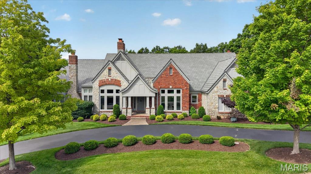 Here is the St Albans Construction built atrium ranch home that highlights superior construction quality and is a home that has been perfectly maintained from its manicured lawn and landscaping to its spotless interiors and exteriors. The stone and brick exterior, slate styled DaVinci roof and circle driveway add to its wonderful curb appeal. Enter thru a beautiful foyer with custom faux painting. All the carpeting on the main floor and on atrium stairway is new in 5/26. The garage floor is epoxy coated. There is a sprinkler system and Beam central vacuum and surround sound music system with dual speakers in every room in the home including garage, deck and patio (excludes 3 bedrooms and office). The home features 4 full masonry fireplaces with gas logs, many high vaulted, wood beamed or trey ceilings, 3 powder rooms with custom faux painting, all bedrooms are ensuite, 8' doors on the main floor, crown molding and wainscoting in the dining room, a Den/Office with double French doors and a wall of built-in bookshelves, a fabulous atrium stairway that captures all the beauty of the treed backyard. Relax on the Trex deck with solar post lighting or on the large aggregate patio in the backyard that backs to landscape lighted trees for privacy and hear the peaceful water feature in the pond behind the house on the golf course beyond. The expansive kitchen features Subzero refrigerator, Viking double convection ovens, Asko Dishwasher, floor kick vacuum, granite countertops, walk-in pantry, vaulted ceiling with wood beams in the kitchen, hearth room and breakfast room. The Primary suite is massive with a private gas logged fireplace, a custom finished 17' x 12' closet, vaulted ceiling, bath with jacuzzi tub and large shower with shower seat. The lower level is perfect for entertaining and for family living or guests visiting. All three bedrooms are ensuite with full bathrooms, large walk-in closets and darkening shades for those who like to sleep in. There is a floor to ceiling stone fireplace with gas logs, a space for billiards and a theater area away from the atrium which is perfect for watching tv. the 3-D theater system is negotiable. The bar features a subzero refrigerator, wine cooler and ice machine. The French door leads to the lower-level patio. The new construction homes being built on the street do not have nearly the features and are costing a much higher price.