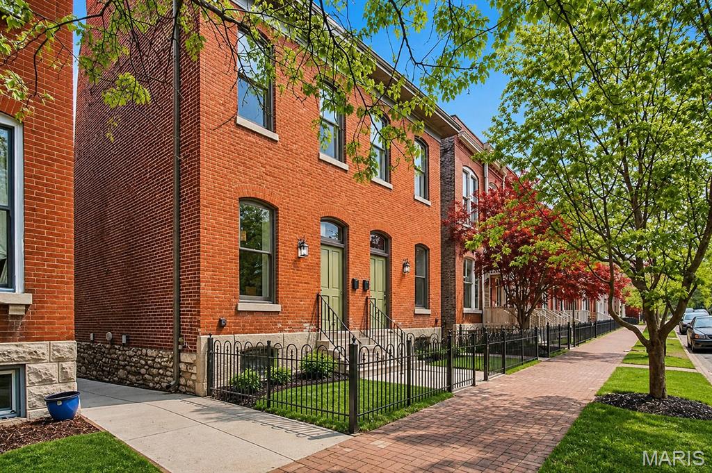 Fully rehabbed 3 bed, 3.5 bath townhouse with wood floors, updated moldings, and contemporary cabinetry throughout. Kitchen features stainless steel appliances, tile work, solid surface counters, and porcelain tile flooring. Main floor bedroom with private deck access (ideal as home office) plus a half bath. 2nd floor master suite includes fireplace mantle, wall of closets, and full ensuite bath; second bedroom has its own private deck; hall full bath completes this level. Finished lower level offers family room, third full bath, storage room, and separate systems room with laundry. Fenced yard, off-street parking. Walk to Lafayette Park and the restaurants/bars of Lafayette Square.