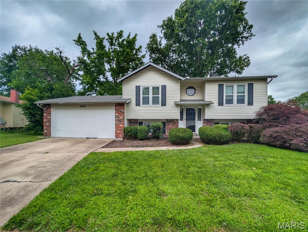 Located in the sought-after Riverwood Trails subdivision, this 3-bedroom, 2 bath split level offers a comfortable and functional floor plan with space to fit a variety of needs. The finished lower level features a cozy family room with a wood-burning fireplace along with a third bedroom that can also serve as a guest room, home office, or flex space. Step outside from the kitchen onto the brand-new deck overlooking the backyard with a new privacy fence, creating an inviting space for entertaining, relaxing or enjoying outdoor activities. Complete with a 2-car garage and conveniently located near shopping, dining, parks and major highways, this home offers a wonderful opportunity to make it your own. Seller is offering a 1-year HSA home warranty for added peace of mind. Schedule your showing today.