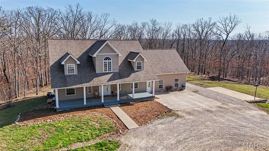 Tucked away on nearly 14 wooded acres, this private retreat offers the space, flexibility, and lifestyle buyers are actively searching for. This 6-bedroom, 3.5-bath home combines an open floor plan with true seclusion, making it ideal for multi-generational living, large households, or anyone craving privacy without sacrificing convenience.

Step into the stunning great room featuring vaulted wood ceilings and a two-story wood-burning fireplace, the perfect centerpiece for gathering and everyday living. The open kitchen includes a center island, bay window, and abundant cabinetry, flowing seamlessly into the main living areas.

The main-floor primary suite provides convenience and comfort, while the private in-law quarters offers incredible versatility for extended family, guests, or a home office setup.

Outside, the property truly shines. Enjoy 13.99 acres of wooded land complete with trails, a natural creek, and abundant wildlife. Whether you're sipping coffee on the oversized deck, hosting summer gatherings by the pool, or enjoying the basketball court, this property delivers a lifestyle that’s hard to find.

Recent updates include a new roof, new well pump, updated lighting, new carpet, and improvements to the primary bath and kitchen. Zoned heating and cooling adds efficiency and comfort year-round.

Located just minutes from Warrenton and Jonesburg, this one-of-a-kind property offers total privacy with convenient access to everyday amenities.

If you've been searching for acreage, privacy, and space to truly live, this is the one!