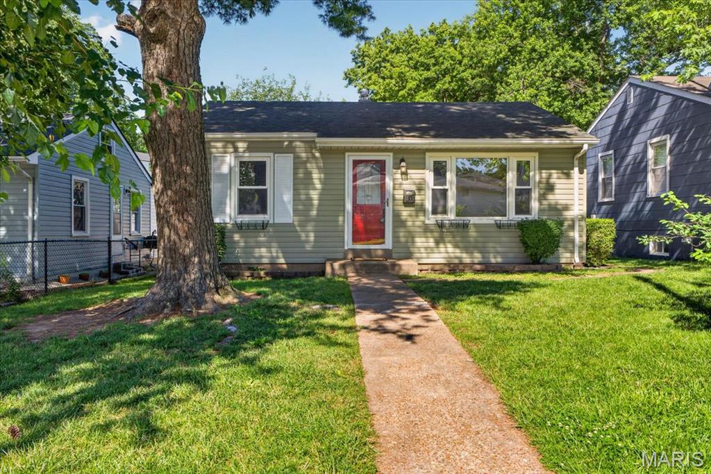 Welcome home to this attractive, light-filled, move-in-ready 2-bedroom in the heart of Dogtown, just moments from Franz Park. This charming home features hardwood floors, fresh paint, and updated fixtures. The eat-in kitchen offers newer appliances and opens to a stunning sunroom—perfect for entertaining, relaxing, or enjoying your morning coffee. Step outside to a beautifully landscaped backyard with a generously sized one-car garage with opener. The partially finished lower level provides additional living space, recreation area, or storage. Major updates include new HVAC and water heater in 2024. Conveniently located near parks, restaurants, shopping, and all the charm Dogtown has to offer.