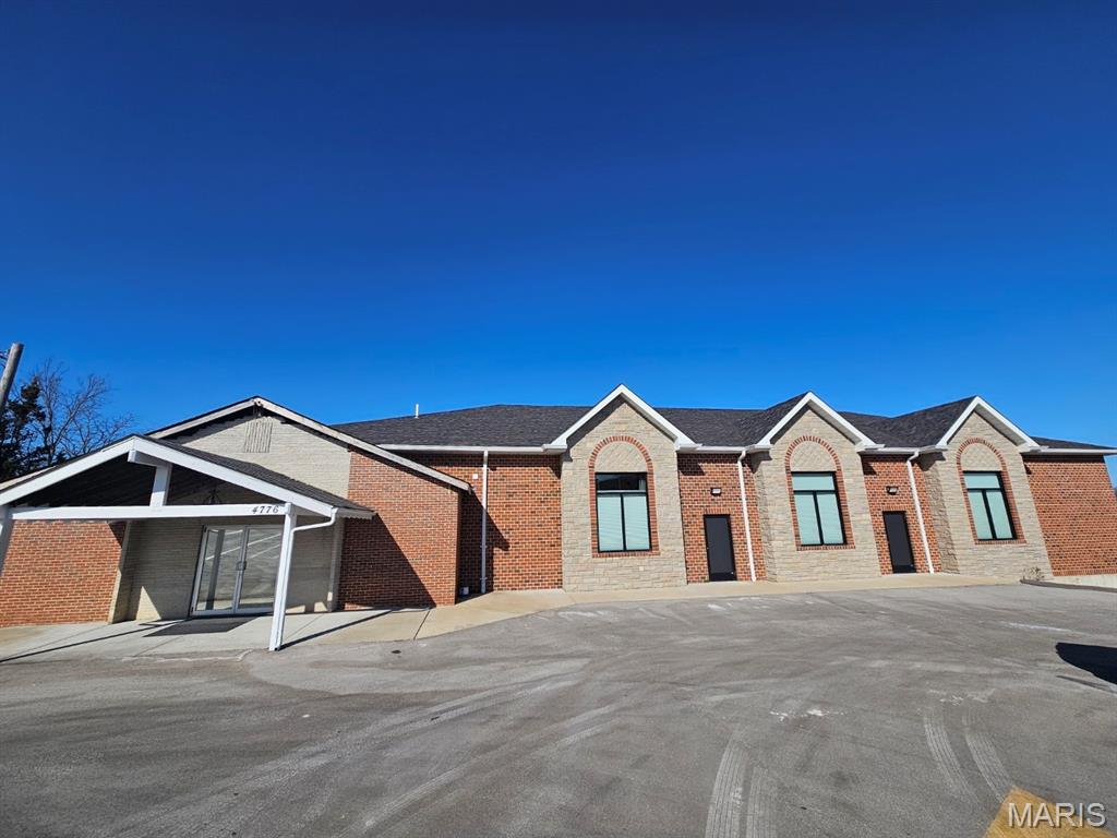 Beautiful church built in 2019. It can easily be converted to office space or whatever you would like it to be! 10 foot ceilings in the basement, complete with a kitchen, TVs, surround sound, and more. The house located at the end of the lot is also included. This is an incredible opportunity.